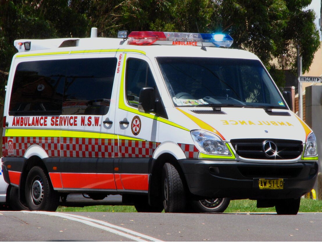 NSW Ambulance paramedic assisting a patient